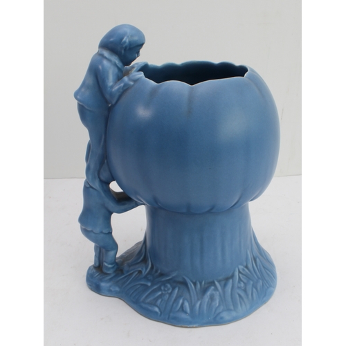 12 - Four ceramic jugs:
 an Art Deco Shelley example with reeded body and varying colours (34 cm high);
 ... 