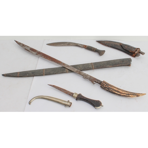 133 - Three bladed weapons:
 1. a machete-style knife (with later horn handle) and wooden scabbard (71 cm)... 