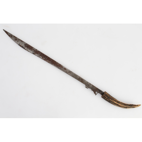 133 - Three bladed weapons:
 1. a machete-style knife (with later horn handle) and wooden scabbard (71 cm)... 