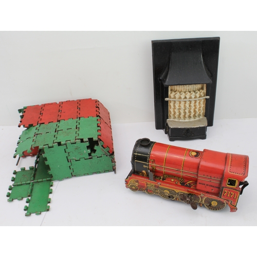 148 - An assortment of children's toys to include:
 two tinplate engines;
 a bell-pistol;
 kitchenware to ... 