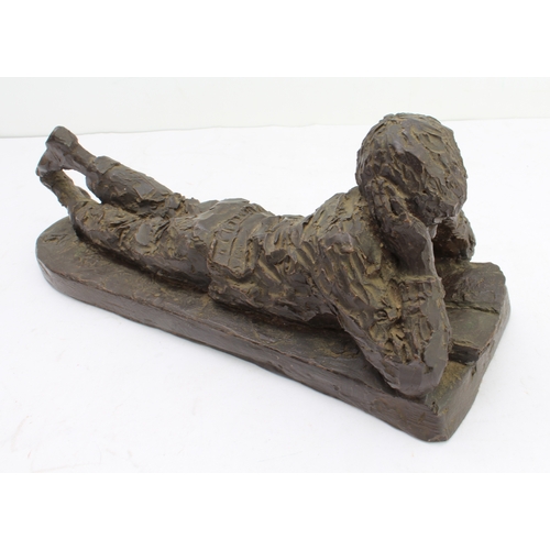 164 - KARIN JONZEN (1914-1998): 'Boy reclining and reading', cold-cast resin, monogrammed 'KJ', Heredities... 