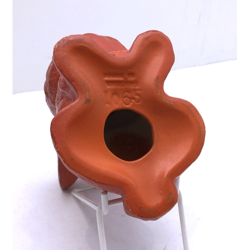 12 - Four ceramic jugs:
 an Art Deco Shelley example with reeded body and varying colours (34 cm high);
 ... 