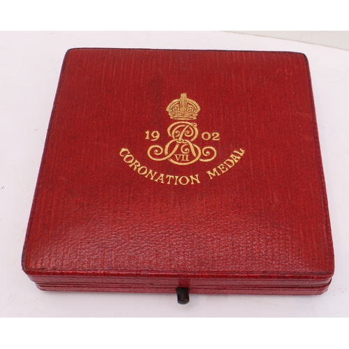 135 - A quantity of commemorative coins and crowns to include:
 a 1902 Edward VII coronation medal in its ... 