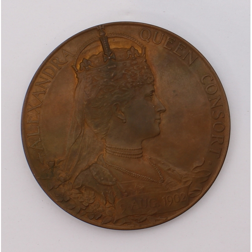 135 - A quantity of commemorative coins and crowns to include:
 a 1902 Edward VII coronation medal in its ... 