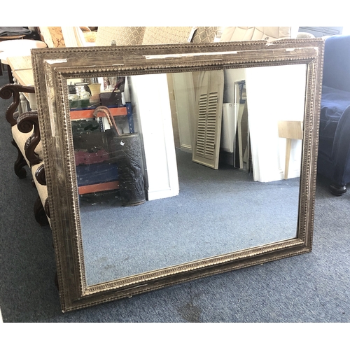 292A - A large Continental gilt and composition mirror, second quarter 20th century, the rectangular plate ... 