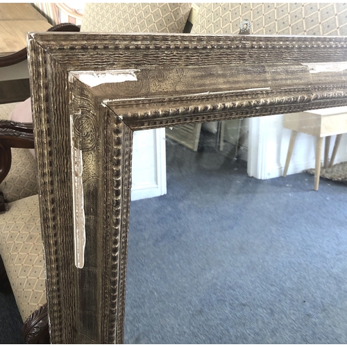 292A - A large Continental gilt and composition mirror, second quarter 20th century, the rectangular plate ... 