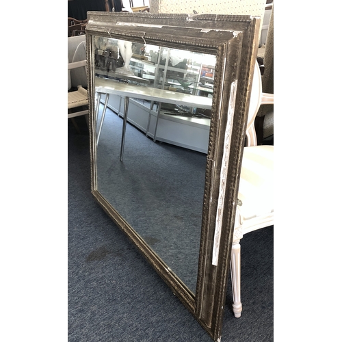 292A - A large Continental gilt and composition mirror, second quarter 20th century, the rectangular plate ... 