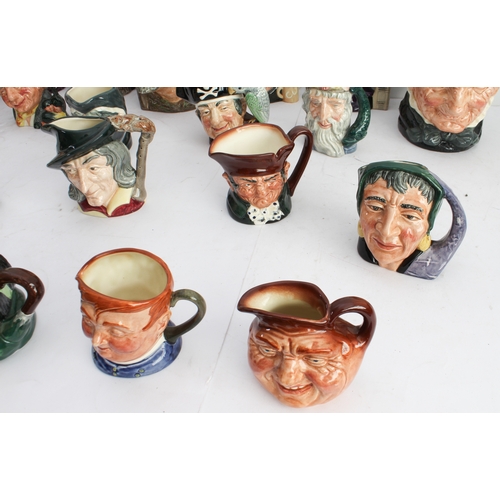 39 - Twenty-two Royal Doulton character jugs (3 large and 19 small). 
 3 large: Granny (D5521), Uncle Tom... 