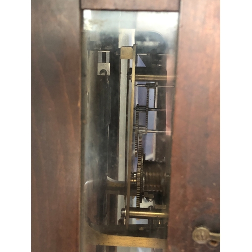 127 - A large 19th century walnut-cased continental Vienna regulator-style wall-hanging clock: the foliate... 