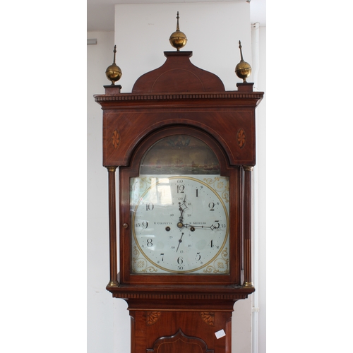 128 - An early 19th century figured mahogany eight-day longcase clock. The 13-inch broken-arch white-paint... 