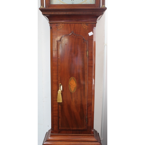 128 - An early 19th century figured mahogany eight-day longcase clock. The 13-inch broken-arch white-paint... 