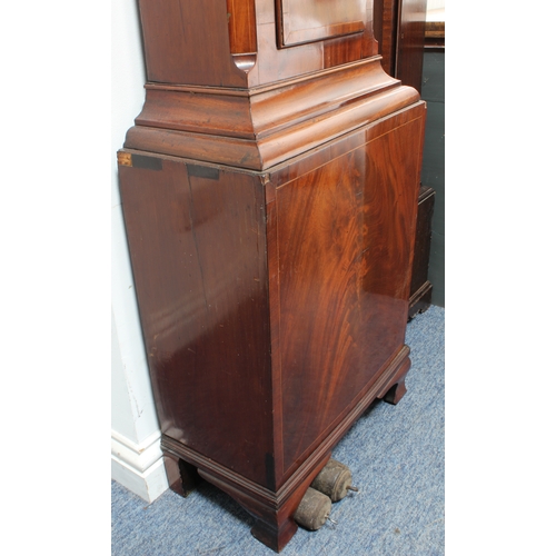 128 - An early 19th century figured mahogany eight-day longcase clock. The 13-inch broken-arch white-paint... 