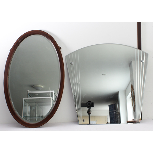 289 - Two mirrors:
 1. an early 20th century oval mahogany and boxwood-strung wall-hanging looking glass h... 