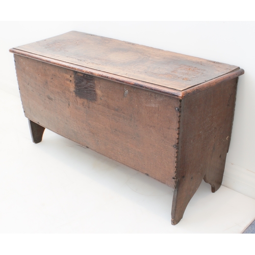 391 - A late 17th century boarded oak chest: the single plank top with later applied thumbnail moulded edg... 