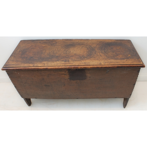 391 - A late 17th century boarded oak chest: the single plank top with later applied thumbnail moulded edg... 