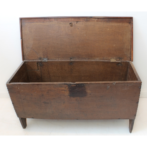 391 - A late 17th century boarded oak chest: the single plank top with later applied thumbnail moulded edg... 