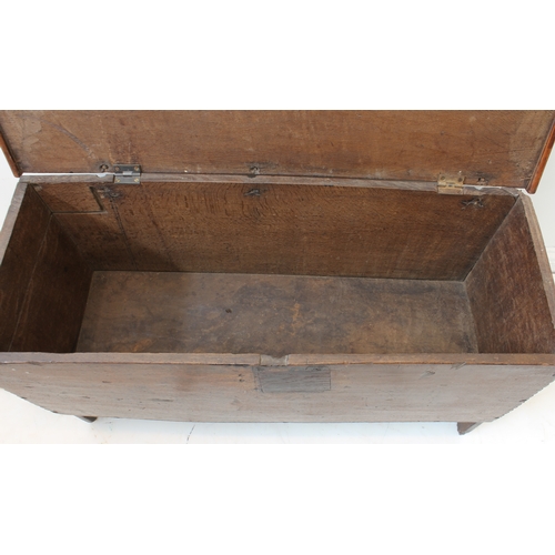 391 - A late 17th century boarded oak chest: the single plank top with later applied thumbnail moulded edg... 