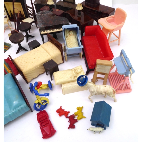 A collection of late 1940s to 1950s dolls house furniture in both the mid century and Georgian Reviv