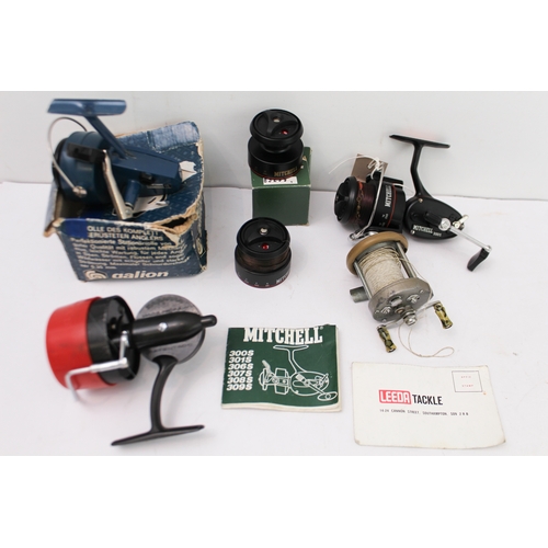 Four vintage spinning reels: comprising a Mitchell 300S with two