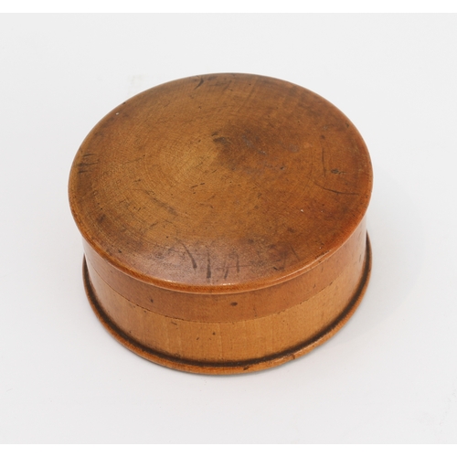 127 - An early 19th century pocket sun-dial and compass set in a turned sycamore case: the central raised ... 