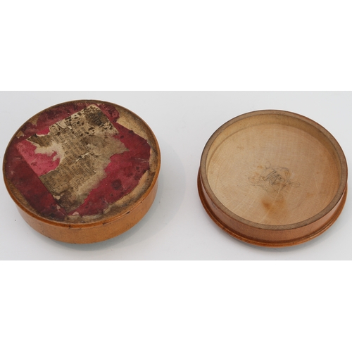 127 - An early 19th century pocket sun-dial and compass set in a turned sycamore case: the central raised ... 