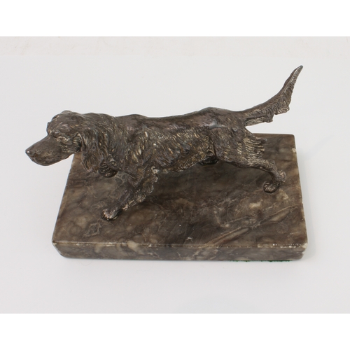 129 - An early 20th century cast-metal model of a German longhaired pointer: the underside marked Germany;... 