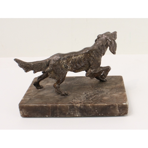 129 - An early 20th century cast-metal model of a German longhaired pointer: the underside marked Germany;... 