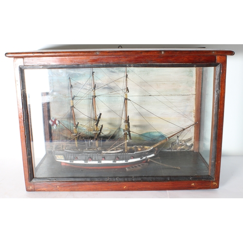 131 - A 19th century mahogany cased and glazed scratch-built diorama-style model of an English man o' war ... 