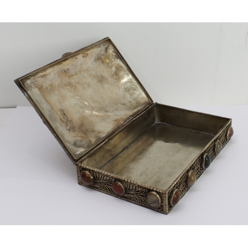 139 - A white metal gilded box with overall filigree decoration and set with numerous cabochon stones, pro... 