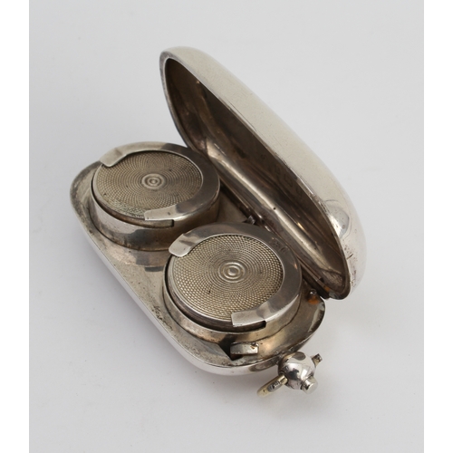 156 - An Edwardian hallmarked silver double sovereign-holder of oval form: the hinged and sprung lid engra... 