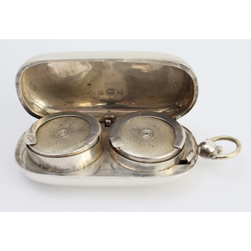 156 - An Edwardian hallmarked silver double sovereign-holder of oval form: the hinged and sprung lid engra... 