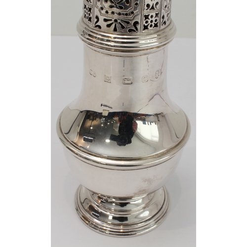 163 - A modern hallmarked silver caster in 18th century style: pierced domed top above a baluster body and... 