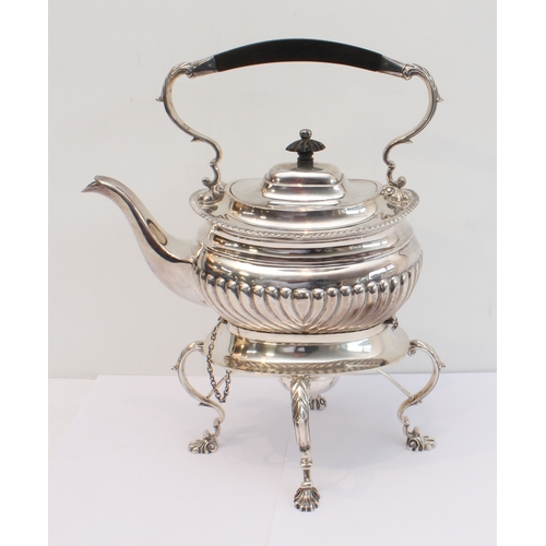 188 - A heavy hallmarked silver spirit kettle on stand. The kettle with tapering fluted bowed ebony handle... 