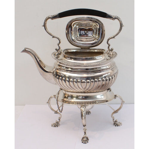 188 - A heavy hallmarked silver spirit kettle on stand. The kettle with tapering fluted bowed ebony handle... 