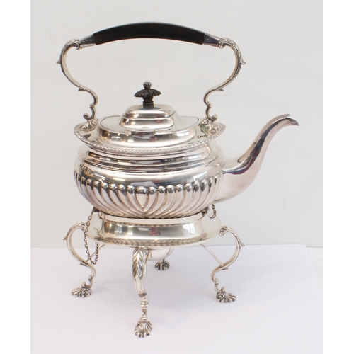 188 - A heavy hallmarked silver spirit kettle on stand. The kettle with tapering fluted bowed ebony handle... 