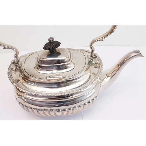 188 - A heavy hallmarked silver spirit kettle on stand. The kettle with tapering fluted bowed ebony handle... 