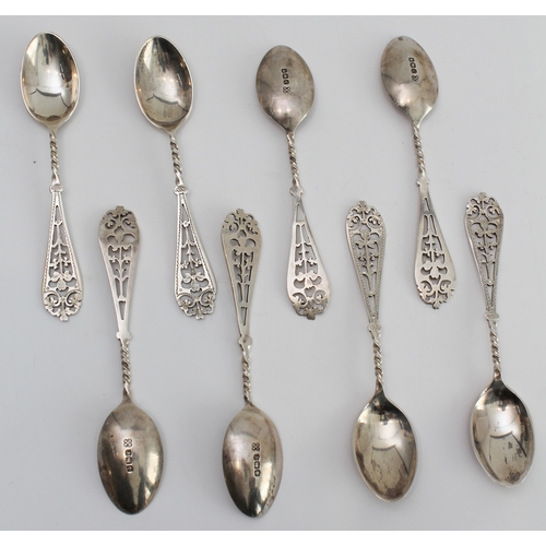 198 - A cased set of twelve George V silver coffee spoons and sugar tongs: pierced terminals with trefoil ... 