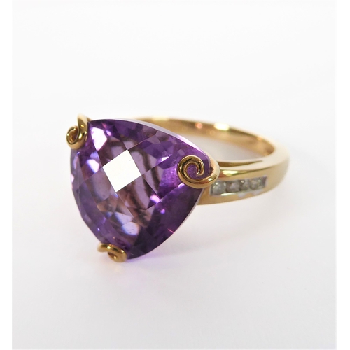 211 - A 9-carat yellow gold dress ring: centrally set with a trillion-cut amethyst of good colour, unusual... 