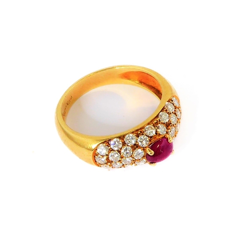 219 - A lady's 18-carat yellow gold (marked 750) dress ring centrally set with a horizontal ruby polished ... 