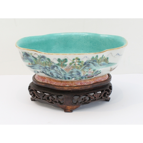 34 - A 20th century Chinese porcelain bowl of quatrefoil form: matt duck-egg blue glazed interior; the ex... 