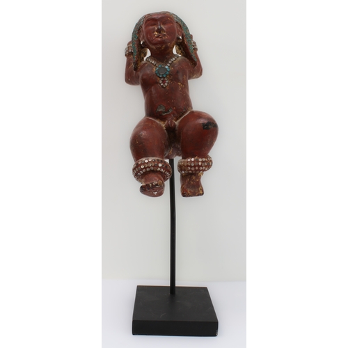 53 - A Burmese wood and red lacquer jewelled figure of a deity: probably late 19th or early 20th century,... 