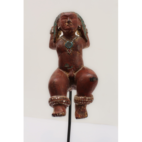 53 - A Burmese wood and red lacquer jewelled figure of a deity: probably late 19th or early 20th century,... 