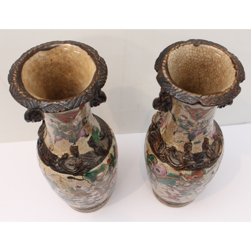 58 - A pair of late 19th to early 20th century Chinese crackleware vases: the slightly waisted neck decor... 