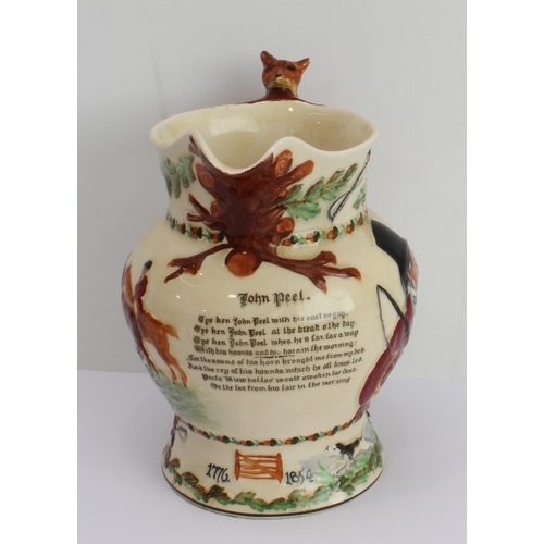 6 - A large Fieldings Crown Devon musical John Peel jug with hunting scene decoration and fox handle