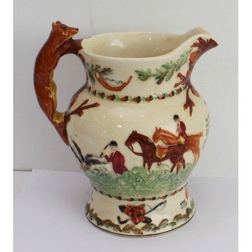 6 - A large Fieldings Crown Devon musical John Peel jug with hunting scene decoration and fox handle