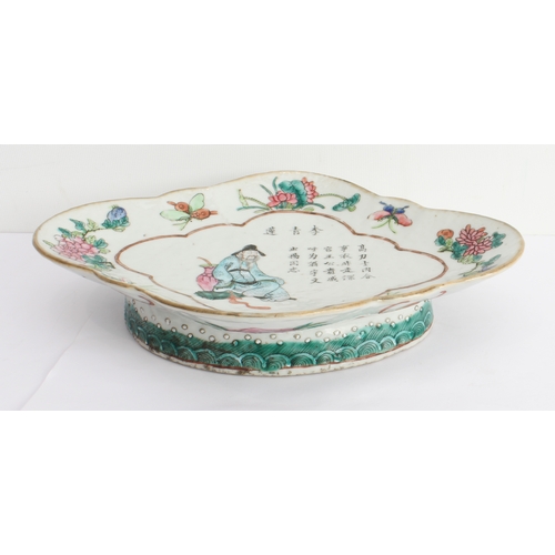 64 - A 19th century Chinese lozenge-shaped pedestal dish decorated in enamels: seated male figure dressed... 