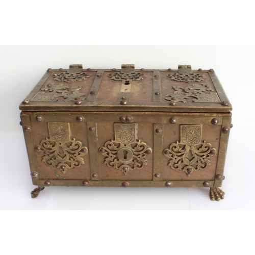 79 - A brass-mounted copper tabletop Armada chest in 17th century German style and of typical strongbox f... 