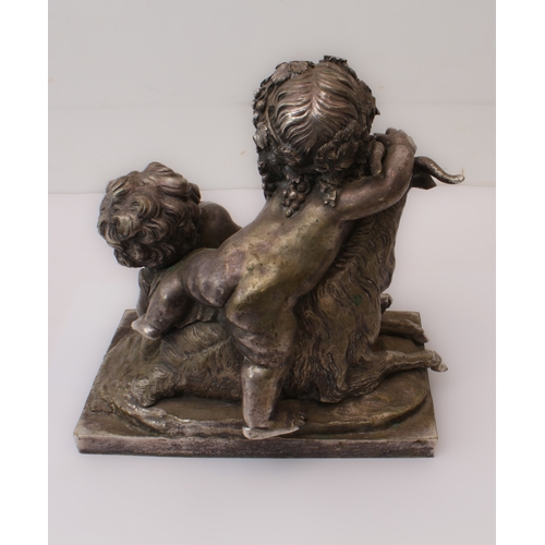 84 - A silvered bronze Bacchanalian figural group: 20th century, depicting two Bacchanalian putti with a ... 