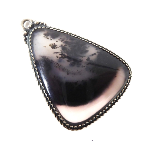 231 - A silver-mounted polished hardstone pendant of triangular form with gadrooned edge (4.5cm high)