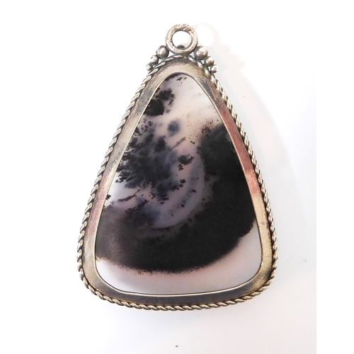 231 - A silver-mounted polished hardstone pendant of triangular form with gadrooned edge (4.5cm high)